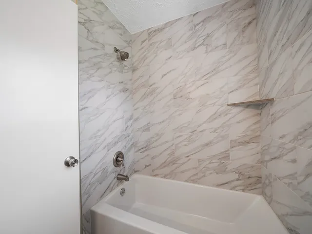 a bathroom with a bathtub