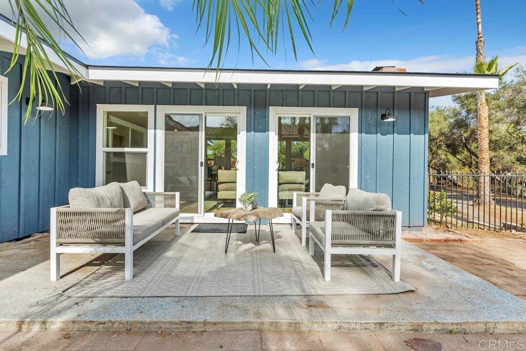 1165 Oak Drive Vista, CA 92084 - Photo 17 of 33 a building outdoor space with patio furniture and potted plants