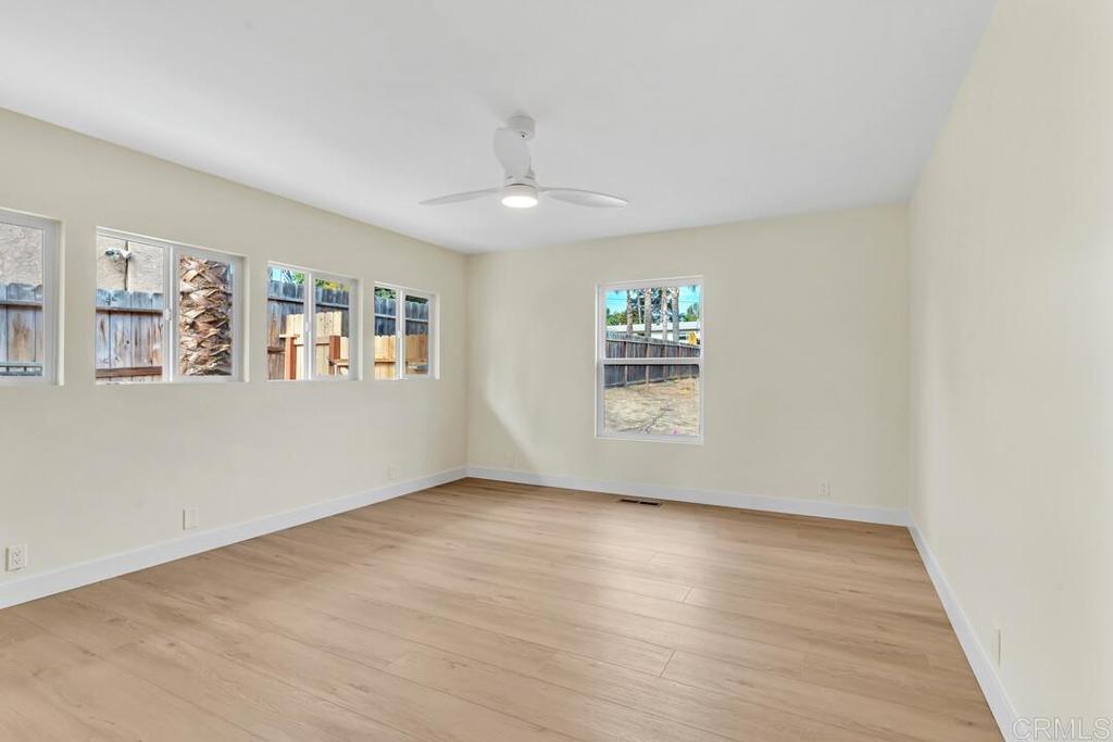 1165 Oak Drive Vista, CA 92084 - Photo 18 of 33 wooden floor in an empty room with a window