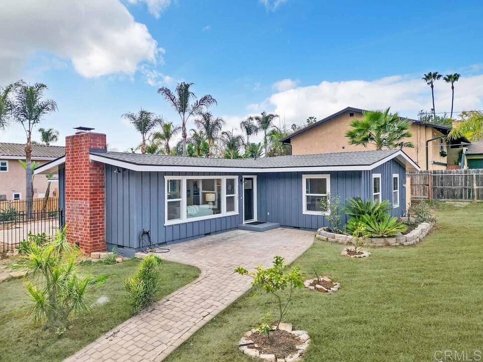 1165 Oak Drive Vista, CA 92084 - Photo 3 of 33 a front view of a house with garden