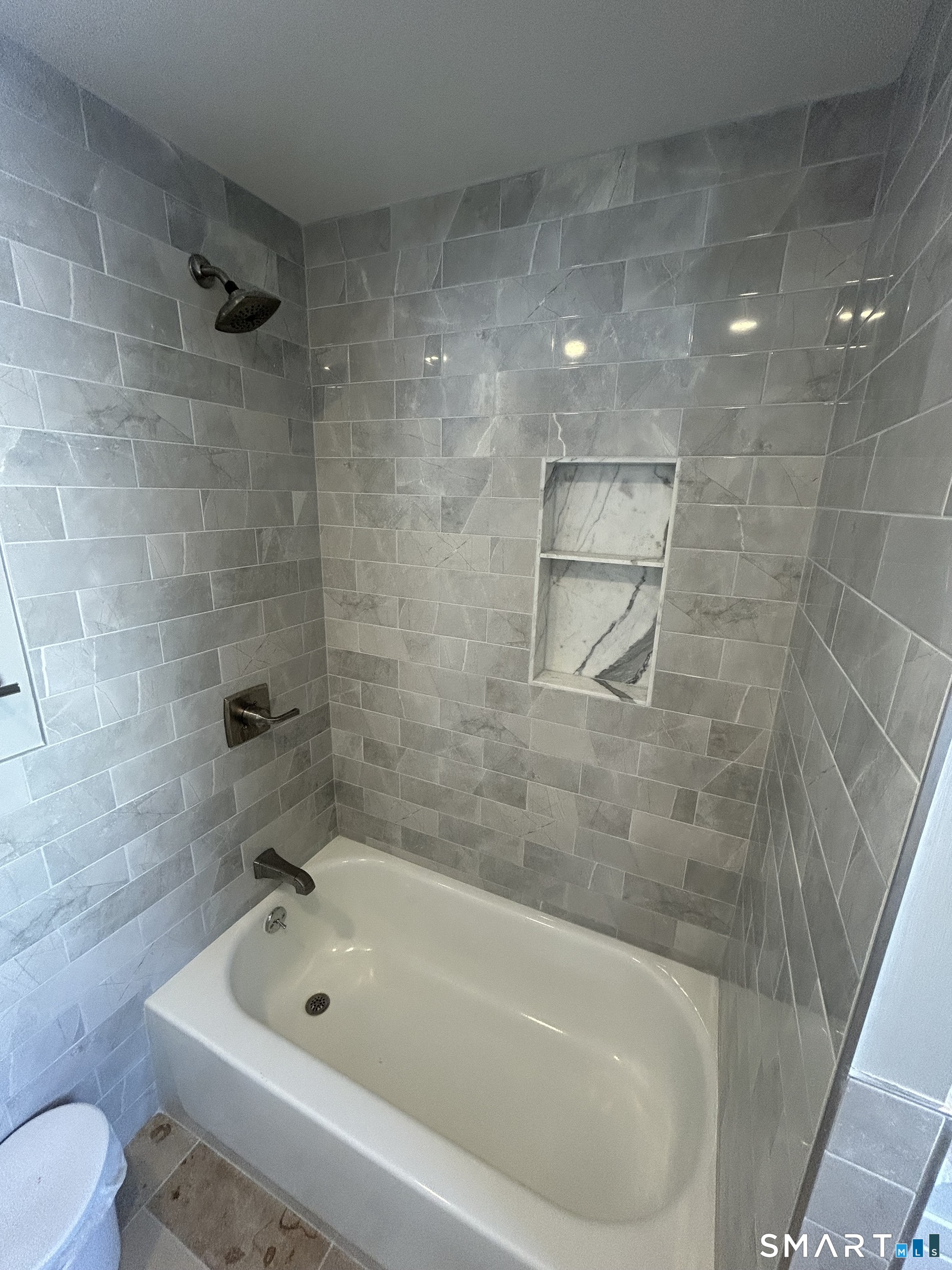 54 Forest Street, Unit 2 Torrington, CT 06790 - Photo 20 of 36 a bathroom with a bathtub and a toilet