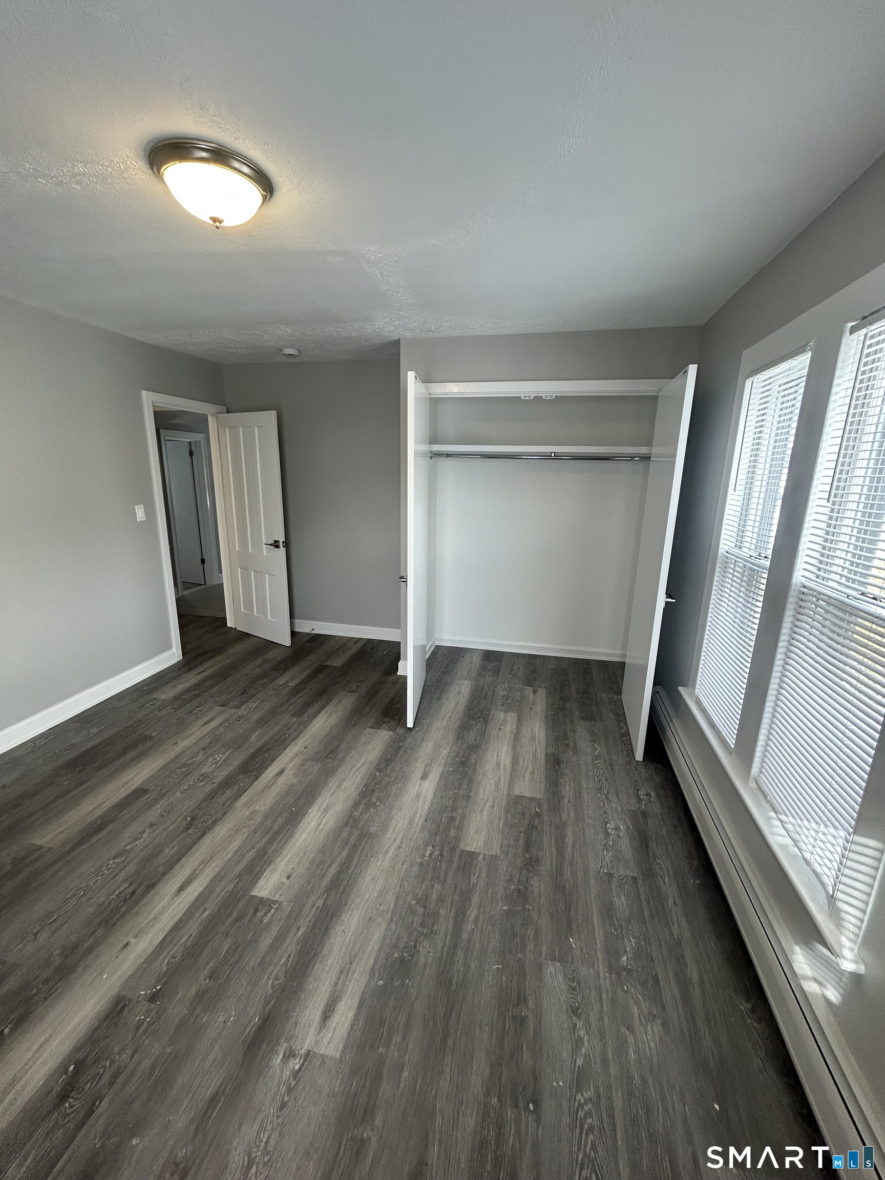54 Forest Street, Unit 2 Torrington, CT 06790 - Photo 24 of 36 wooden floor in an empty room with a window