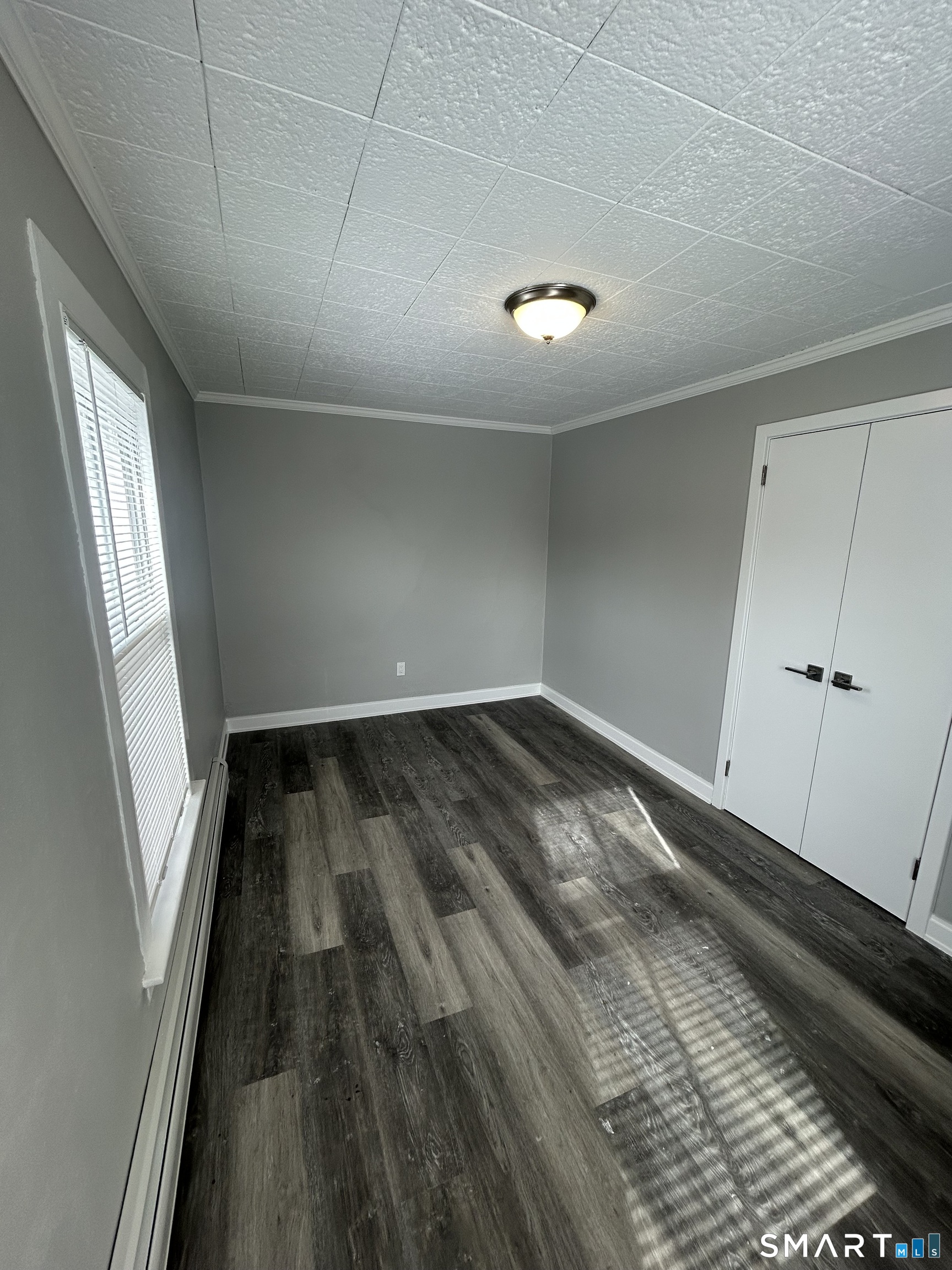 54 Forest Street, Unit 2 Torrington, CT 06790 - Photo 26 of 36 a view of empty room with wooden floor