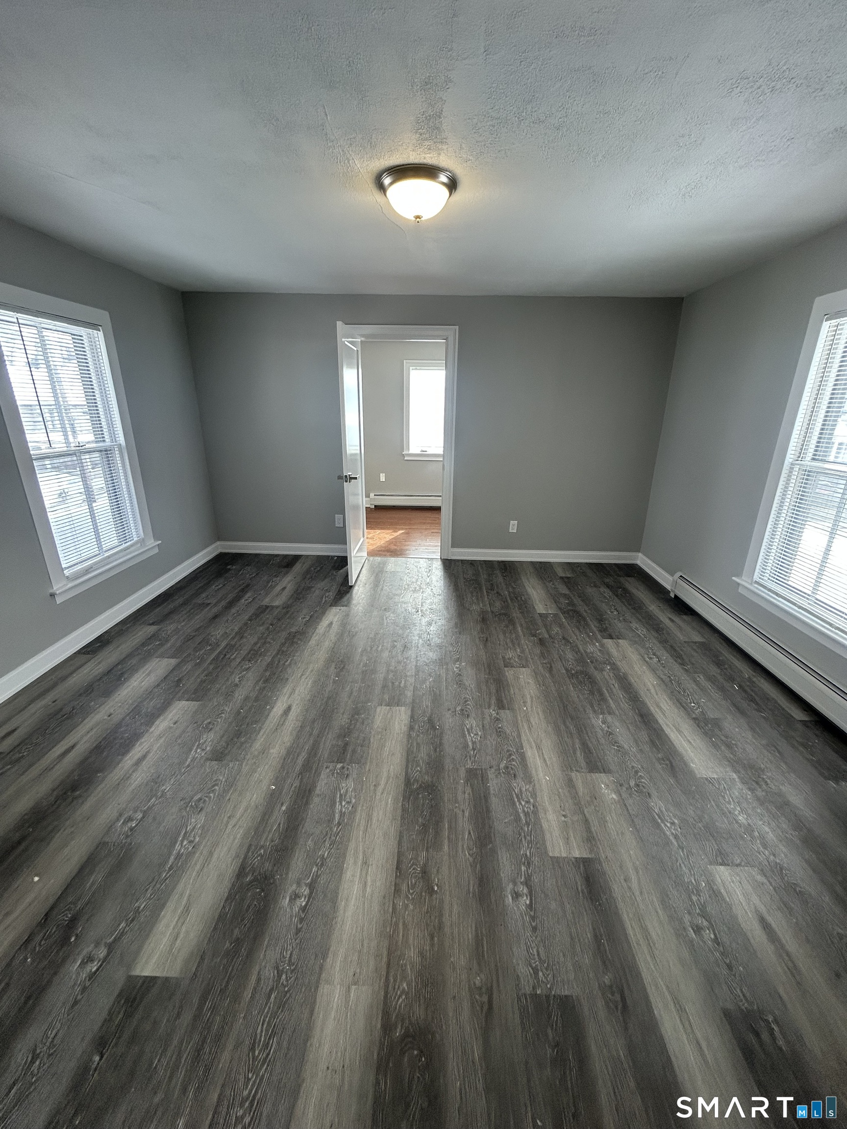 54 Forest Street, Unit 2 Torrington, CT 06790 - Photo 30 of 36 wooden floor in an empty room with a window