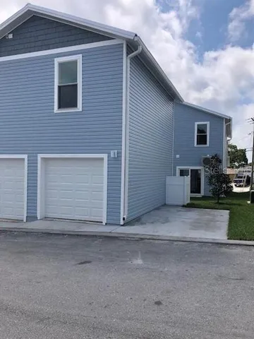 a front view of house with garage
