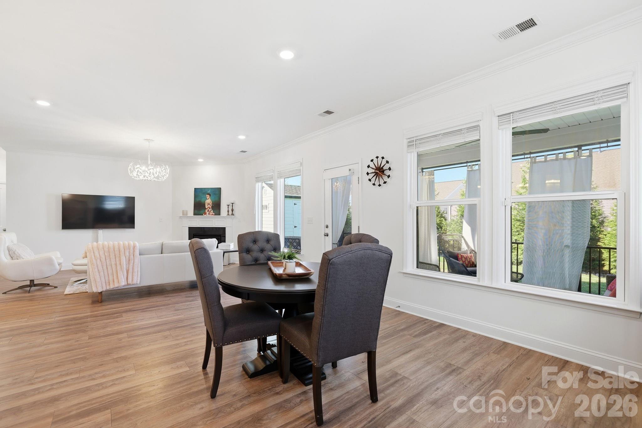 6038 Holland Street Fort Mill, SC 29707 - Photo 15 of 48 a view of a dining room with furniture and wooden floor
