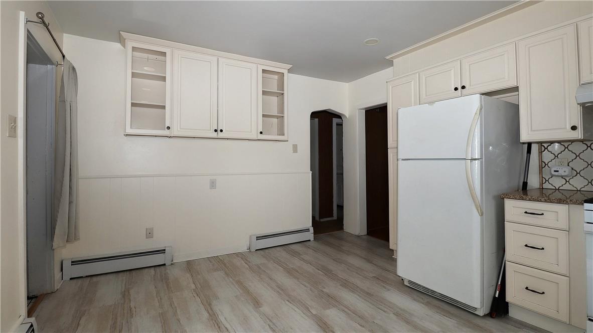 172 Harrison Street Emmaus, PA 18049 - Photo 7 of 30 Functional kitchen offering ample cabinetry and durable laminate flooring.