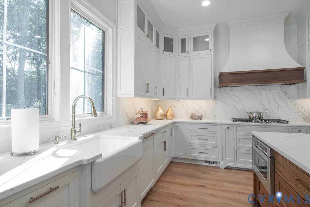 1509 Buford Road North Chesterfield, VA 23235 - Photo 17 of 50 a kitchen with granite countertop white cabinets and white appliances
