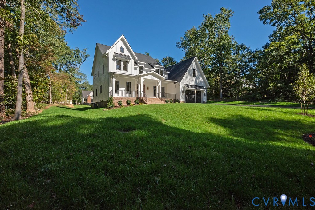 1509 Buford Road North Chesterfield, VA 23235 - Photo 3 of 50 a front view of a house with a garden