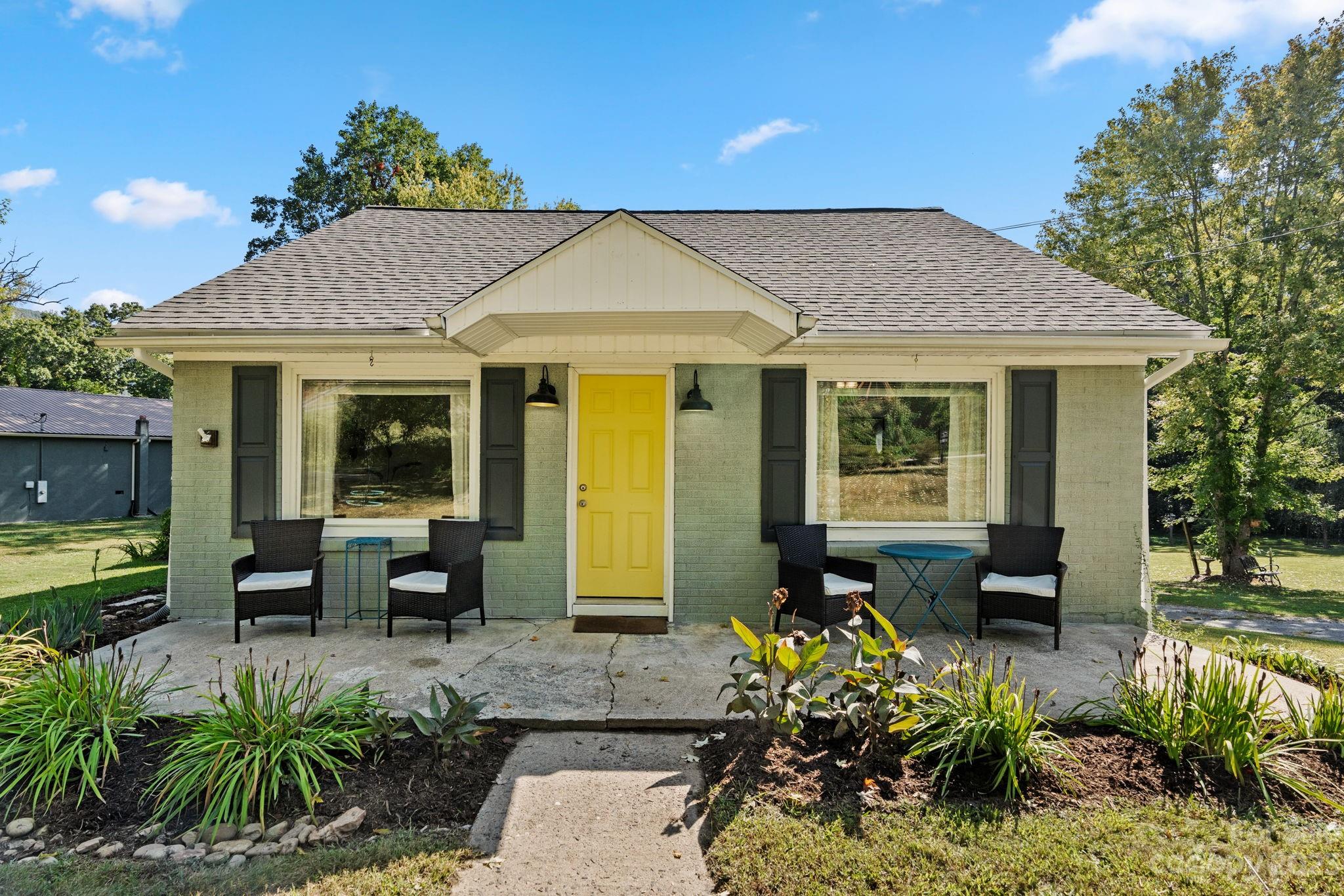 35 Old Fort Road Fairview, NC 28730 - Photo 1 of 30 a front view of a house with a garden