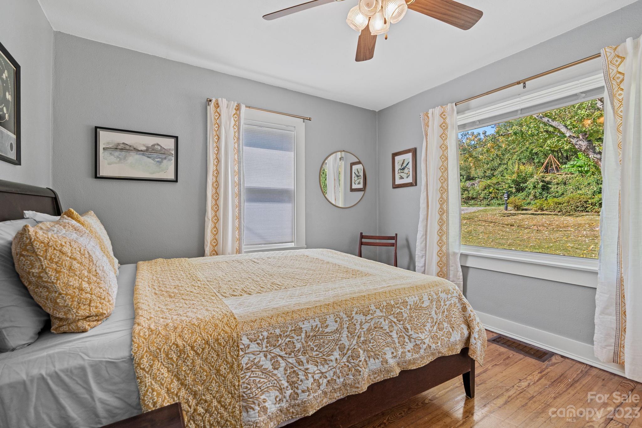 35 Old Fort Road Fairview, NC 28730 - Photo 17 of 30 a bedroom with a large bed and a window