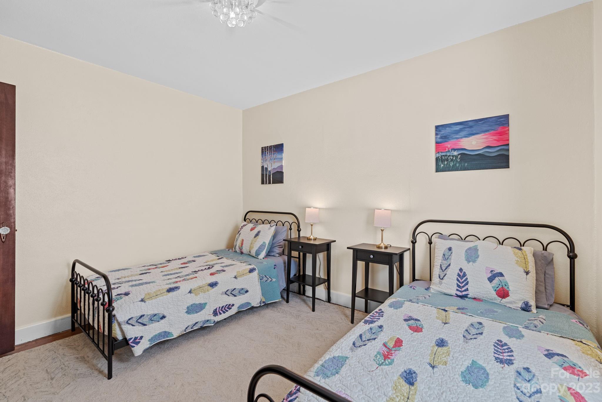 35 Old Fort Road Fairview, NC 28730 - Photo 19 of 30 a bedroom with two beds and painted walls