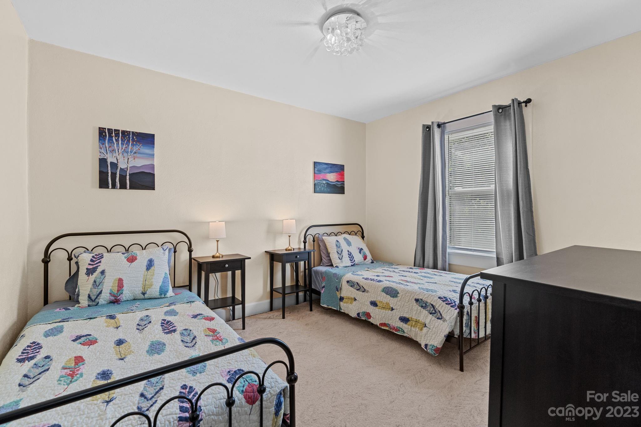 35 Old Fort Road Fairview, NC 28730 - Photo 20 of 30 a bedroom with two beds and a desk