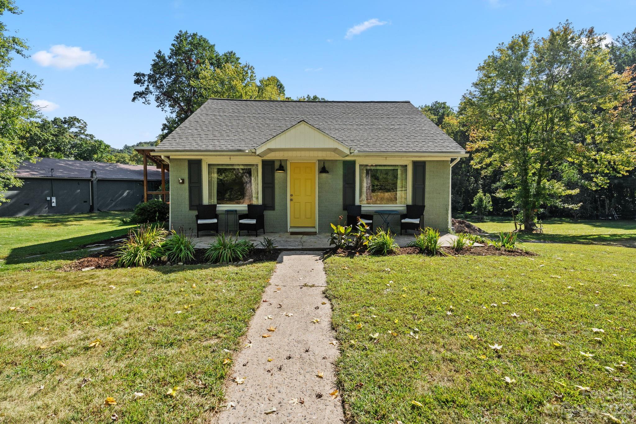 35 Old Fort Road Fairview, NC 28730 - Photo 2 of 30 a view of a house with backyard garden and swimming pool
