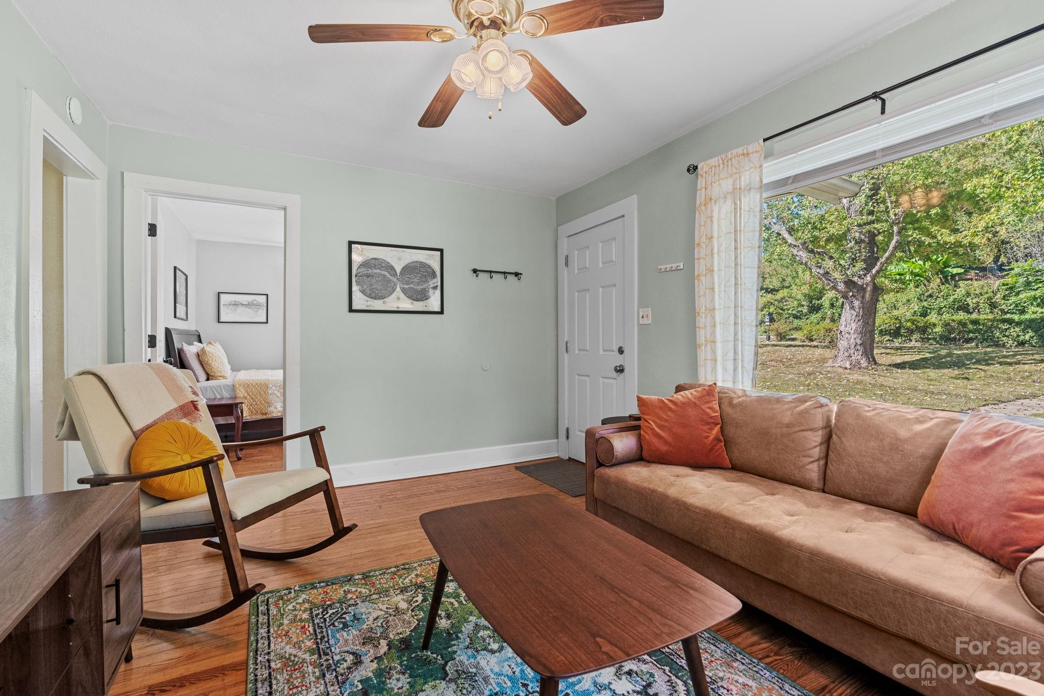 35 Old Fort Road Fairview, NC 28730 - Photo 7 of 30 a living room with furniture and a large window