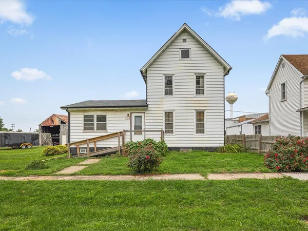 a front view of a house with a yard