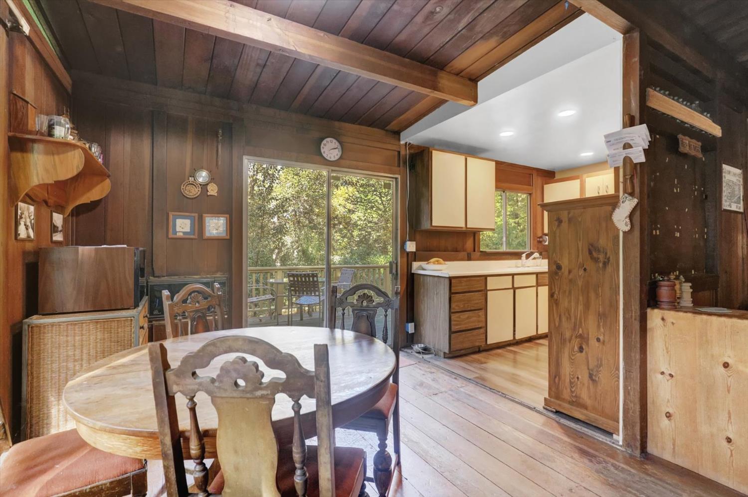 10046 Smith Road Grass Valley, CA 95949 - Photo 12 of 52 a view of a dining room with furniture window and wooden floor