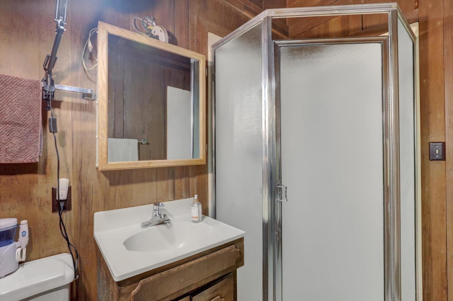 10046 Smith Road Grass Valley, CA 95949 - Photo 22 of 52 a bathroom with a sink and a mirror