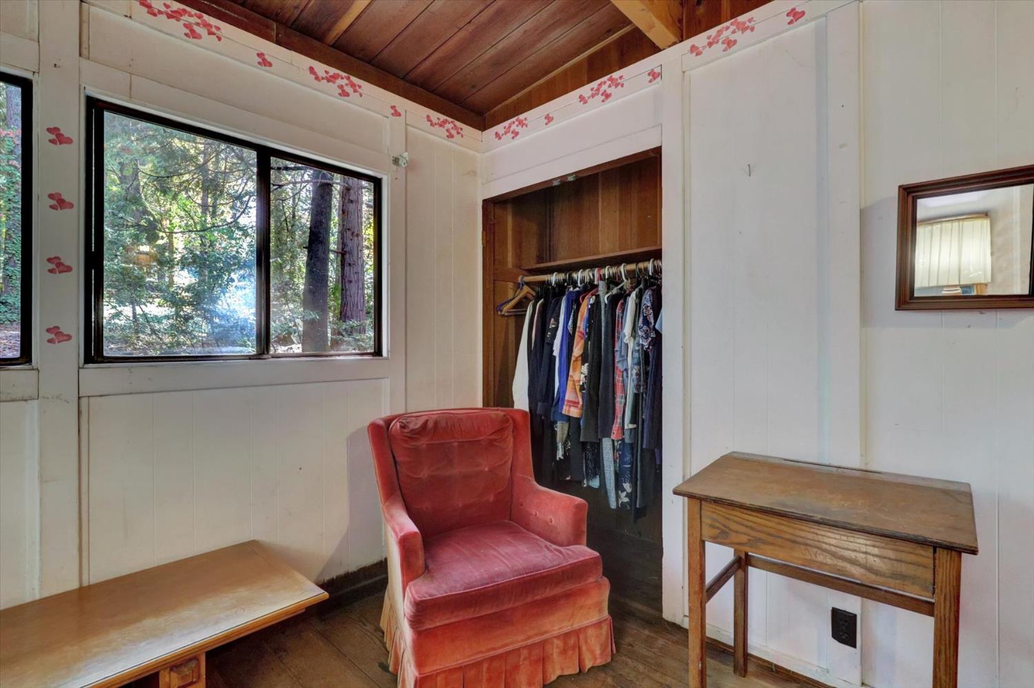 10046 Smith Road Grass Valley, CA 95949 - Photo 24 of 52 a room with furniture and a window