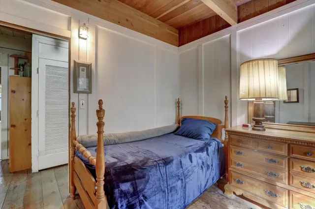 a bed room with a bed and furniture