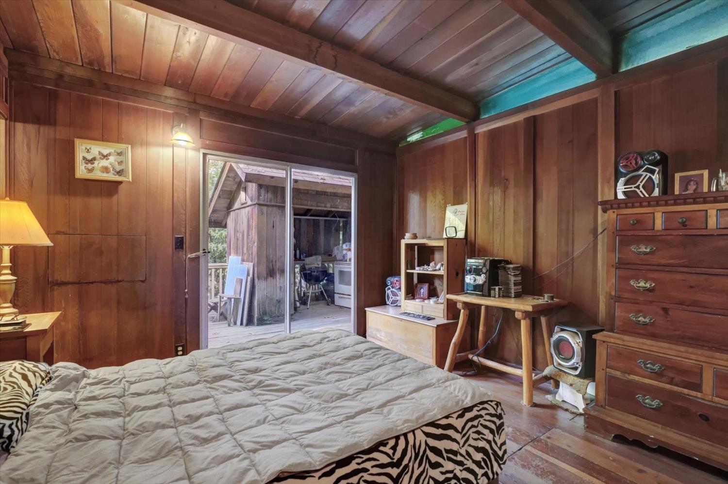 10046 Smith Road Grass Valley, CA 95949 - Photo 27 of 52 a bed room with a bed and furniture