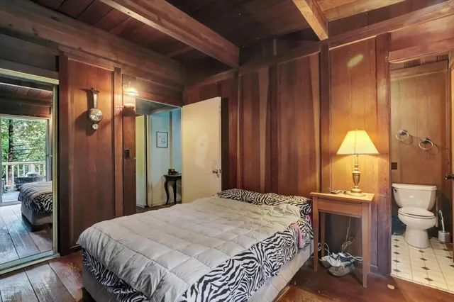 a bed room with a bed and a book shelf