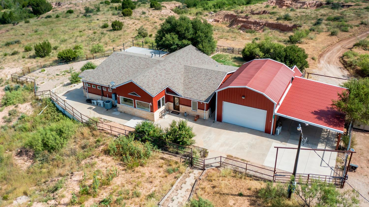396 County Road 130 Slaton, TX 79364 - Photo 1 of 50 an aerial view of a house with a yard