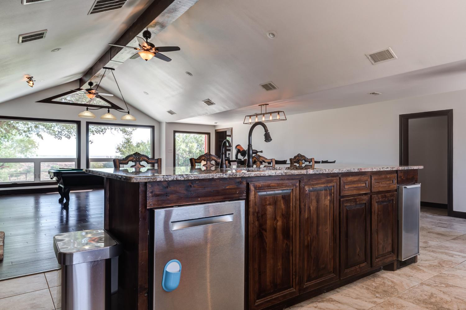 396 County Road 130 Slaton, TX 79364 - Photo 17 of 50 a view of a kitchen and living room