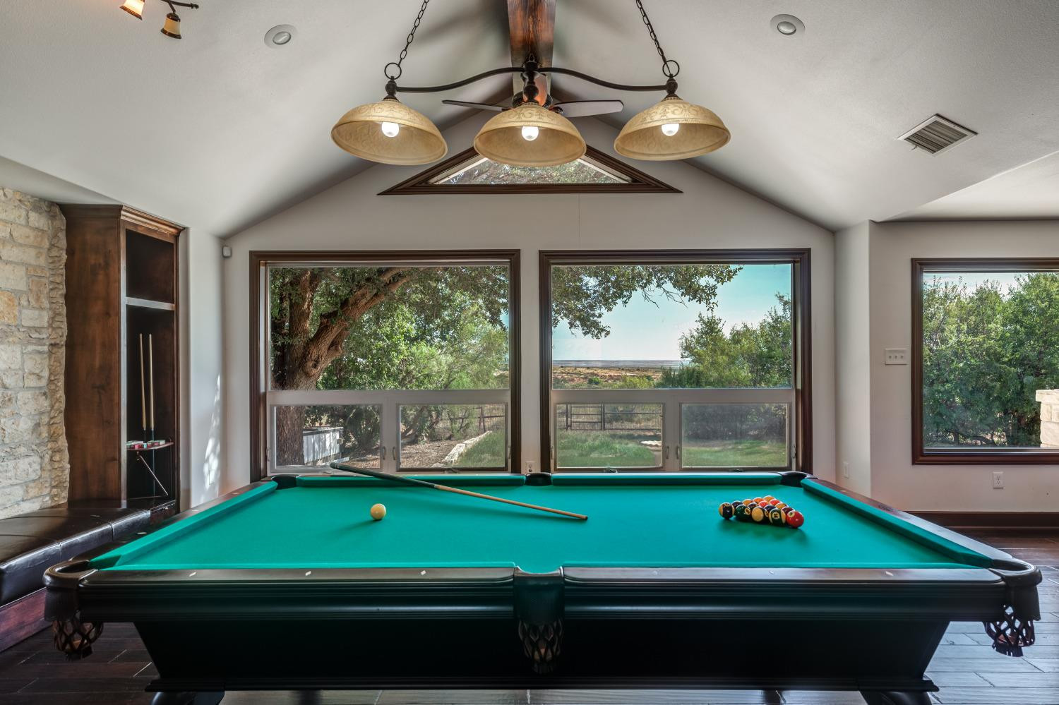 396 County Road 130 Slaton, TX 79364 - Photo 26 of 50 a room with pool table and windows