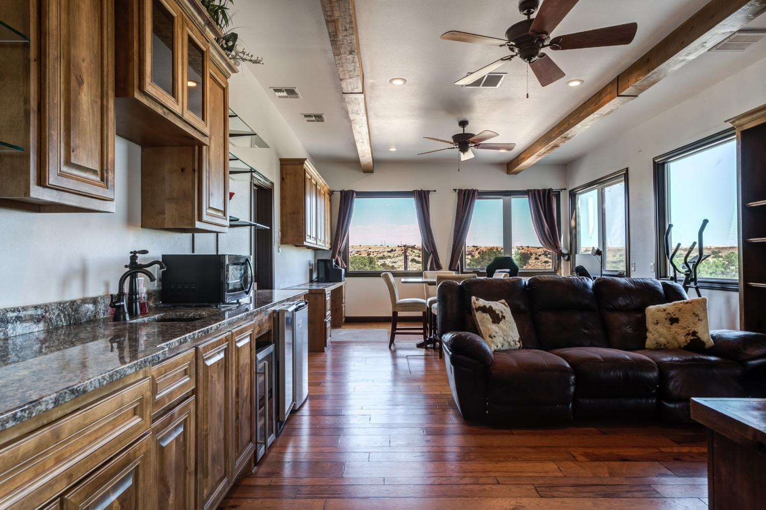 396 County Road 130 Slaton, TX 79364 - Photo 28 of 50 a living room with furniture kitchen view and a wooden floor