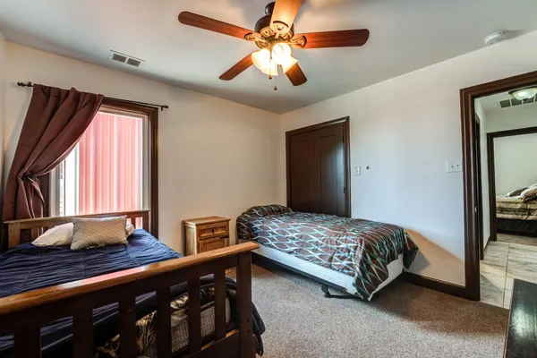 a bedroom with bed and window