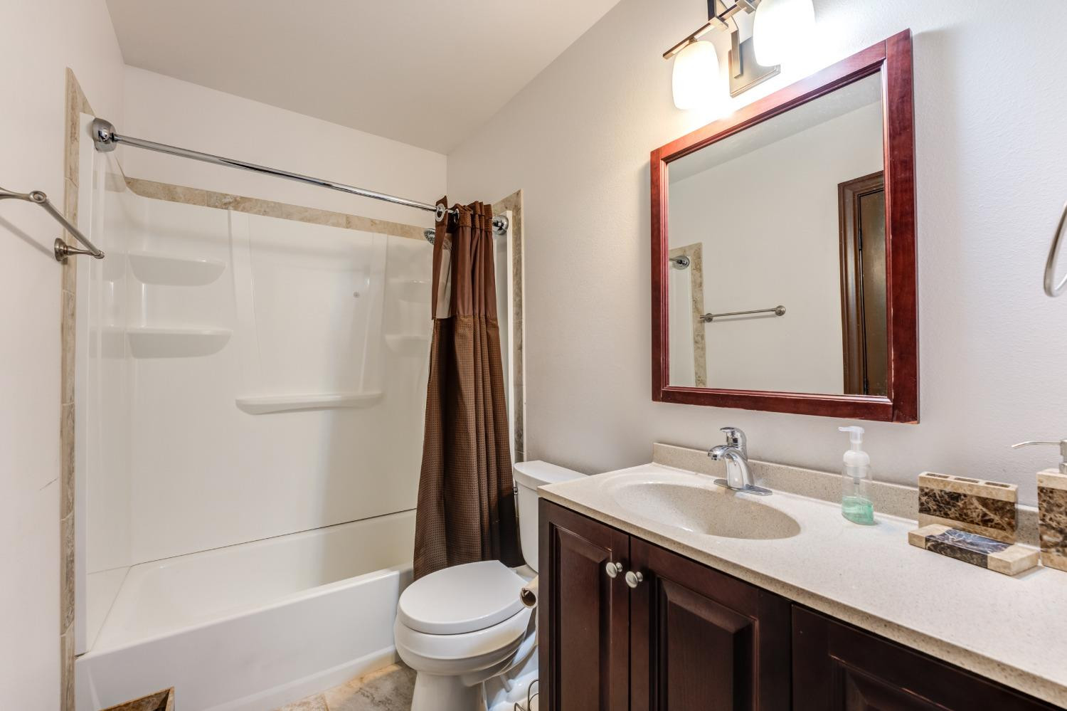 396 County Road 130 Slaton, TX 79364 - Photo 41 of 50 a bathroom with a granite countertop sink toilet and shower
