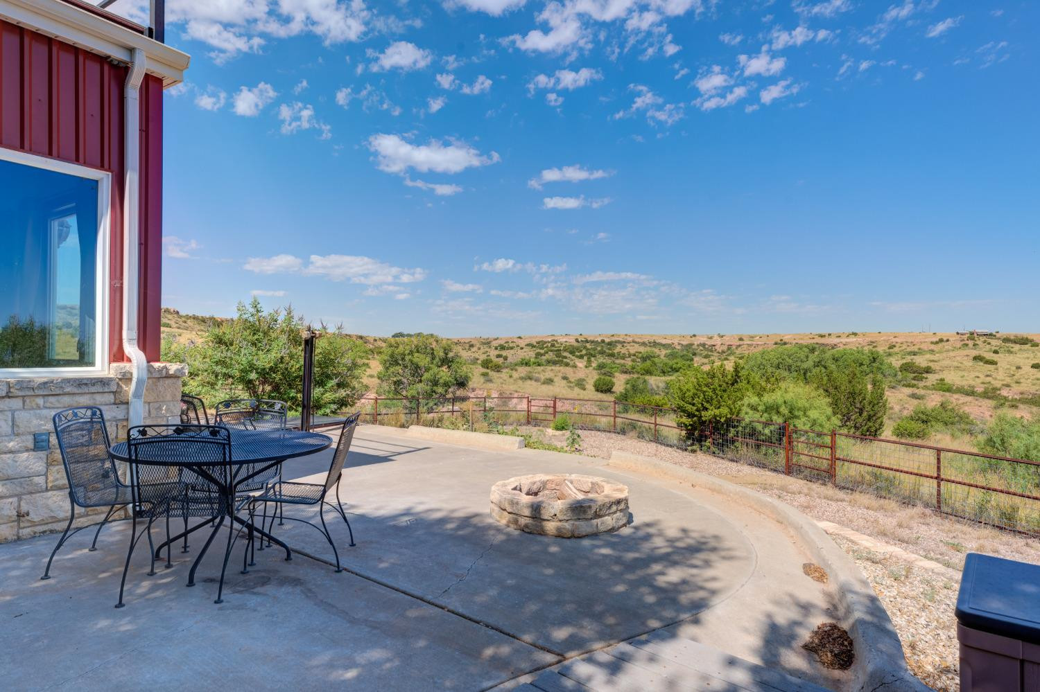 396 County Road 130 Slaton, TX 79364 - Photo 45 of 50 a view of a terrace with furniture and a garden