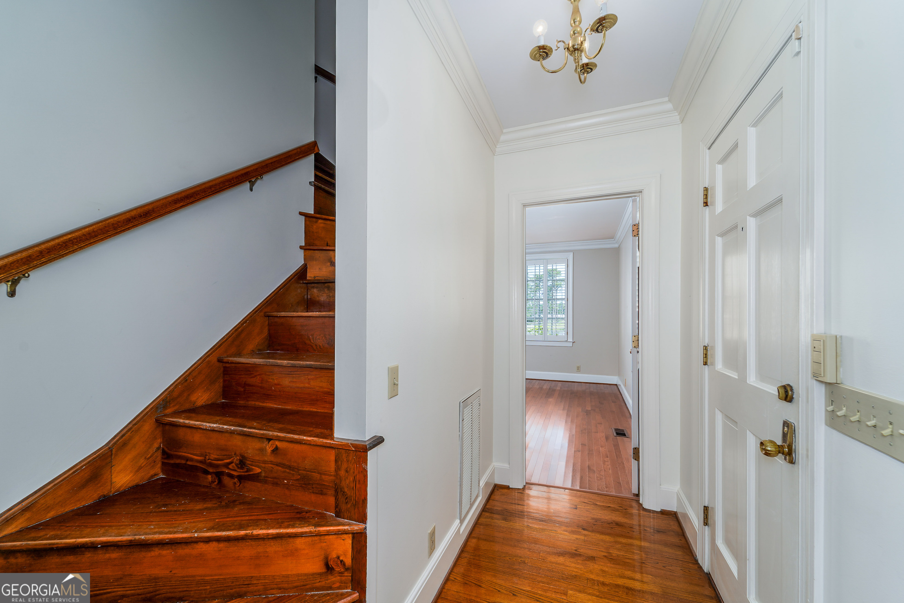 1602 Ward St Extension West Douglas, GA 31533 - Photo 38 of 70 a view of a hallway with wooden floor and staircase