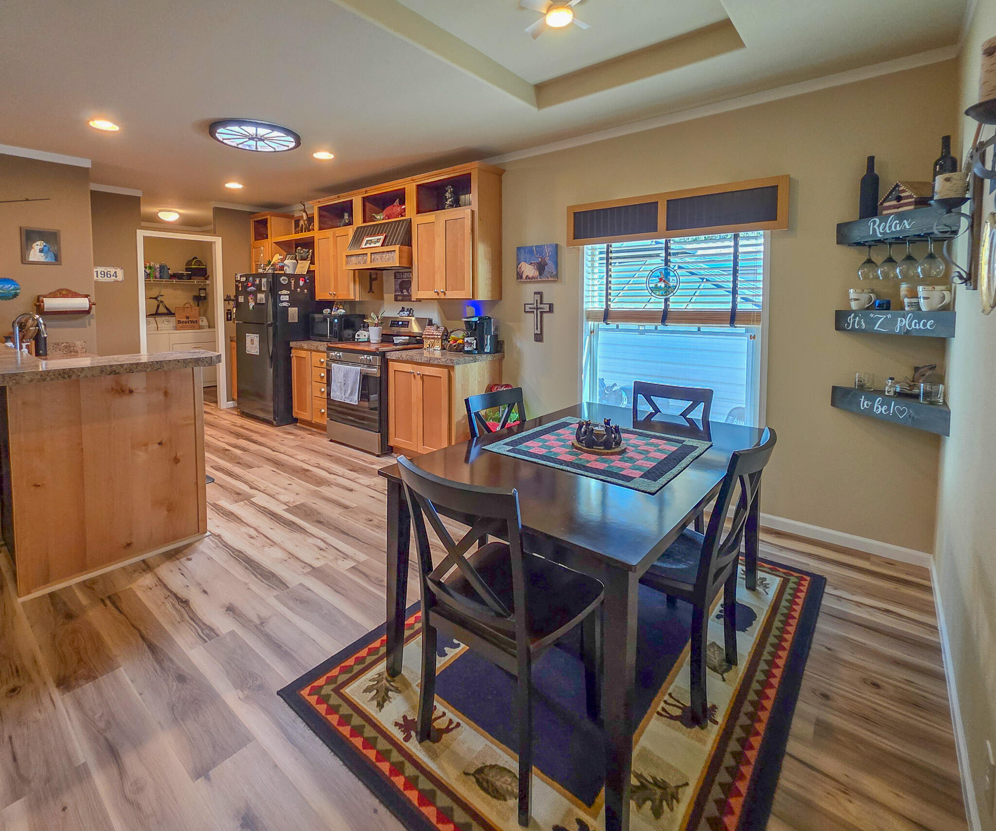 537 Thompson Creek Road, Unit 16 Jacksonville, OR 97530 - Photo 13 of 30 a dining room with furniture and wooden floor