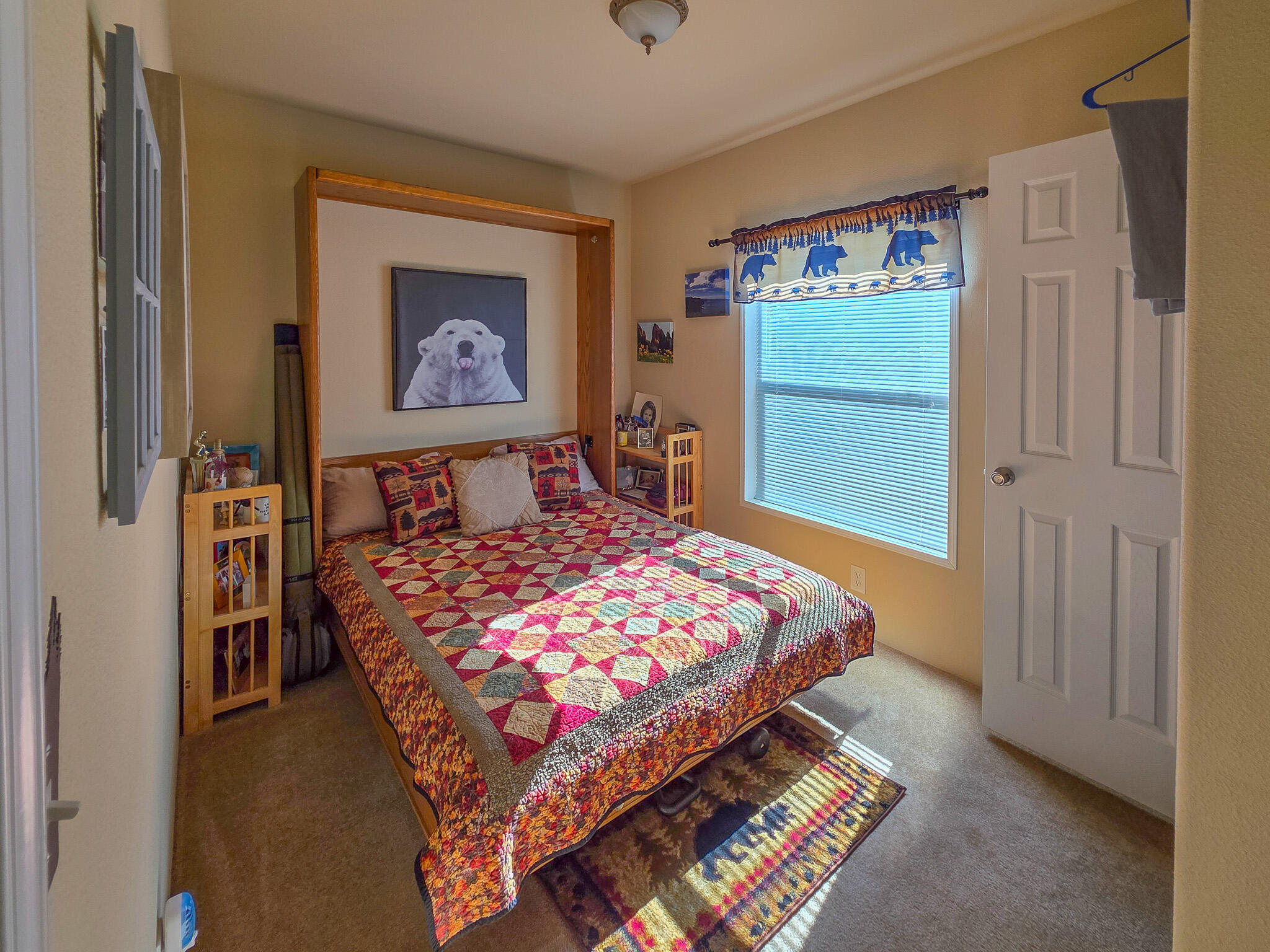 537 Thompson Creek Road, Unit 16 Jacksonville, OR 97530 - Photo 20 of 30 a bedroom with a bed and a painting on the wall