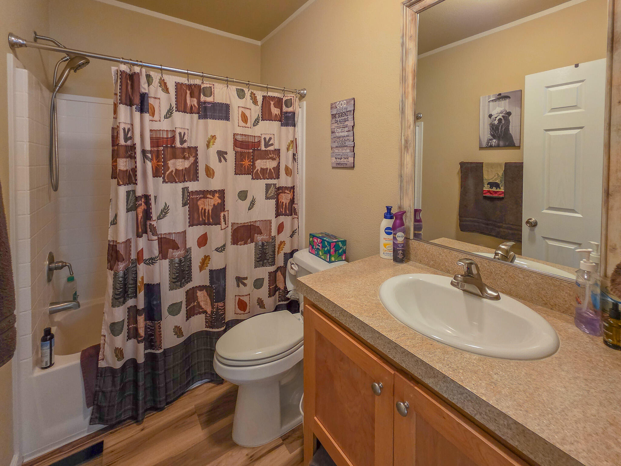 537 Thompson Creek Road, Unit 16 Jacksonville, OR 97530 - Photo 22 of 30 a bathroom with a sink toilet and shower