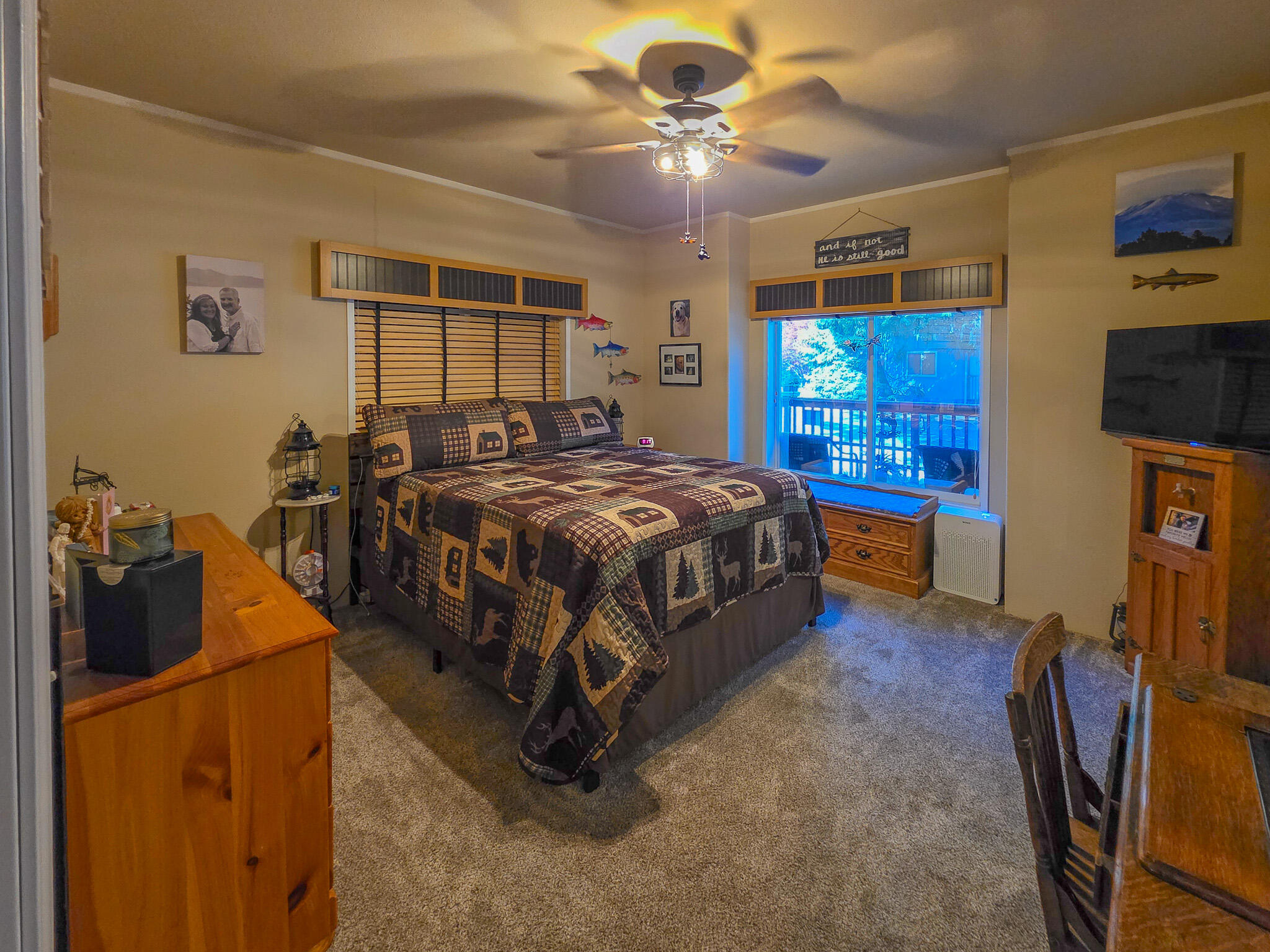 537 Thompson Creek Road, Unit 16 Jacksonville, OR 97530 - Photo 6 of 30 a bedroom with a bed and a flat tv screen on the dresser