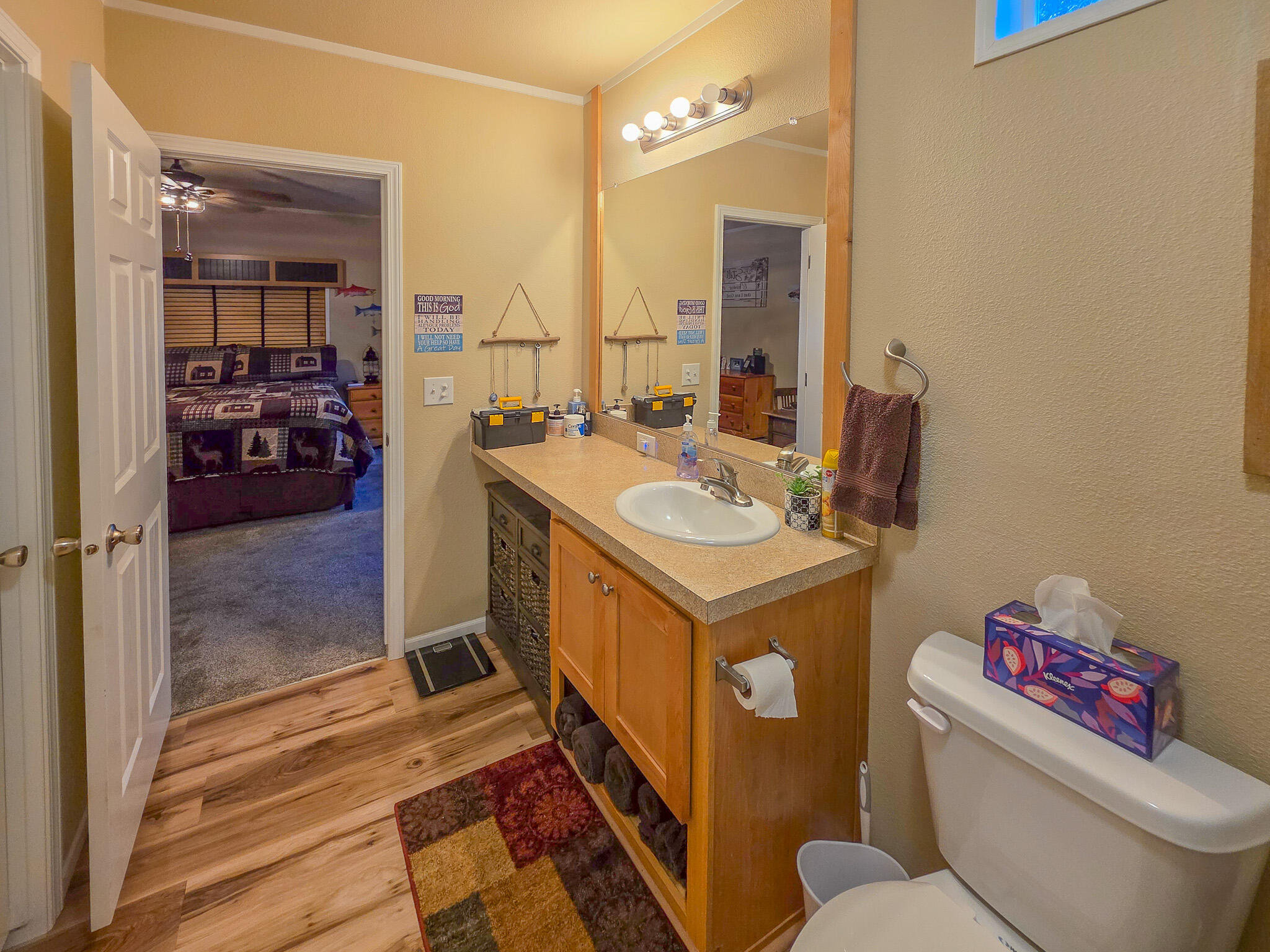 537 Thompson Creek Road, Unit 16 Jacksonville, OR 97530 - Photo 8 of 30 a bathroom with a sink toilet vanity and a mirror