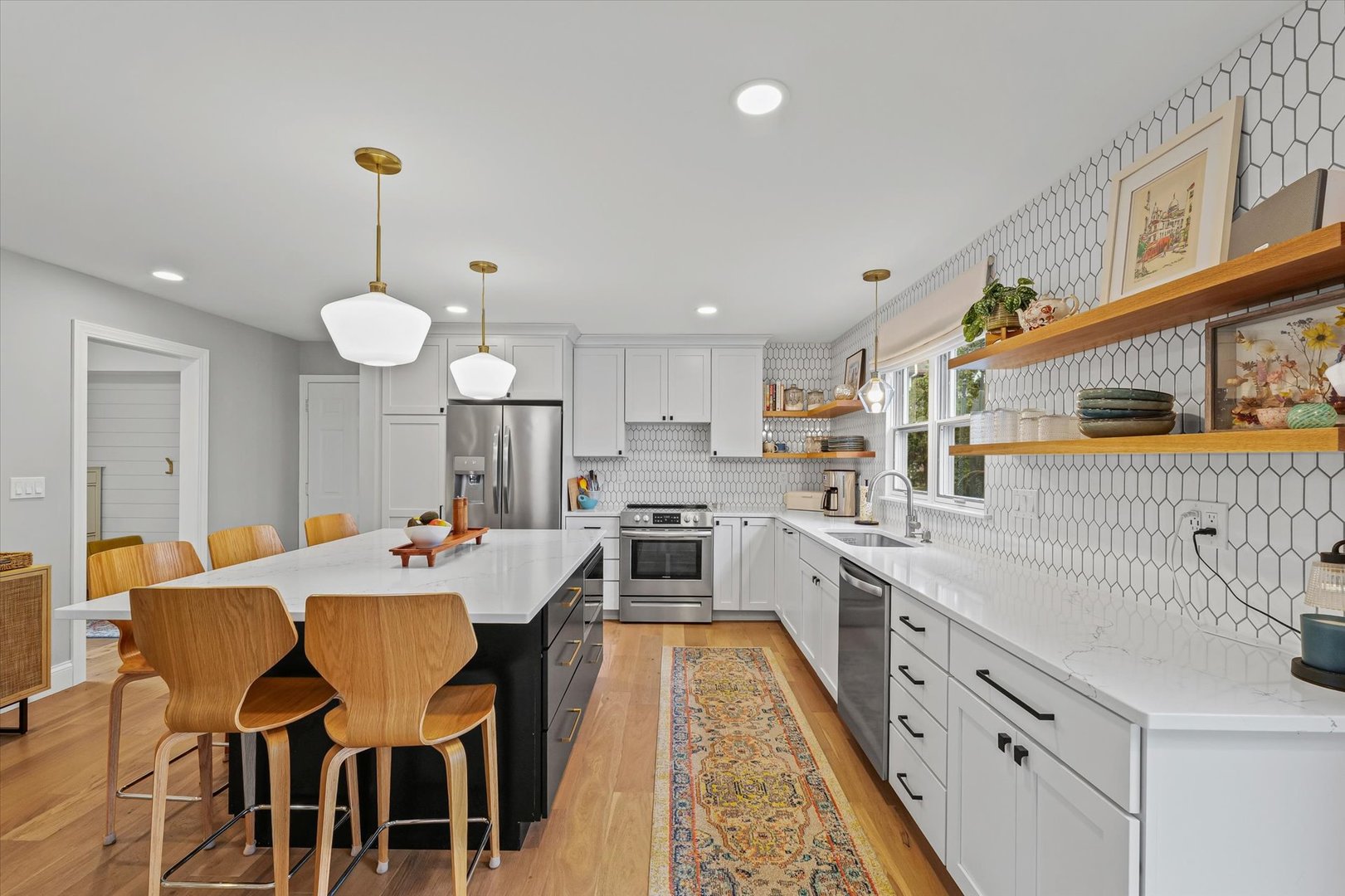 2504 Branch Road Champaign, IL 61822 - Photo 16 of 52 a large kitchen with kitchen island a dining table and chairs