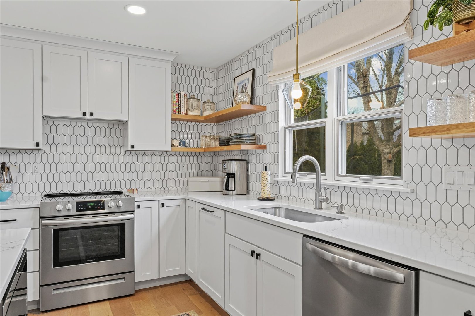 2504 Branch Road Champaign, IL 61822 - Photo 17 of 52 a kitchen with a sink stove and cabinets