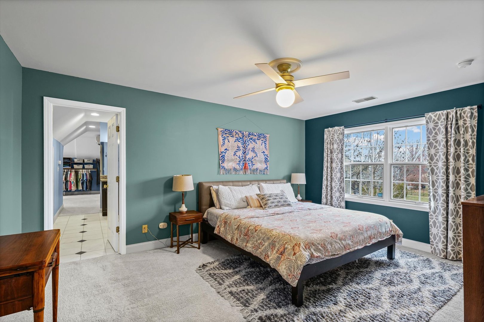 2504 Branch Road Champaign, IL 61822 - Photo 31 of 52 a bedroom with a bed and a chandelier