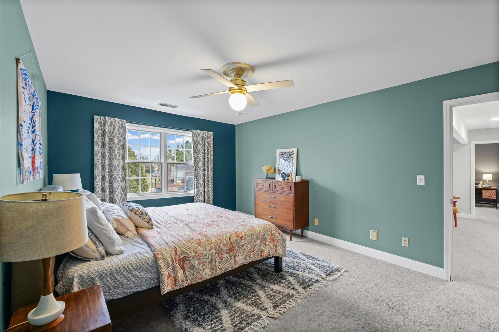 2504 Branch Road Champaign, IL 61822 - Photo 32 of 52 a bedroom with a bed and a chandelier