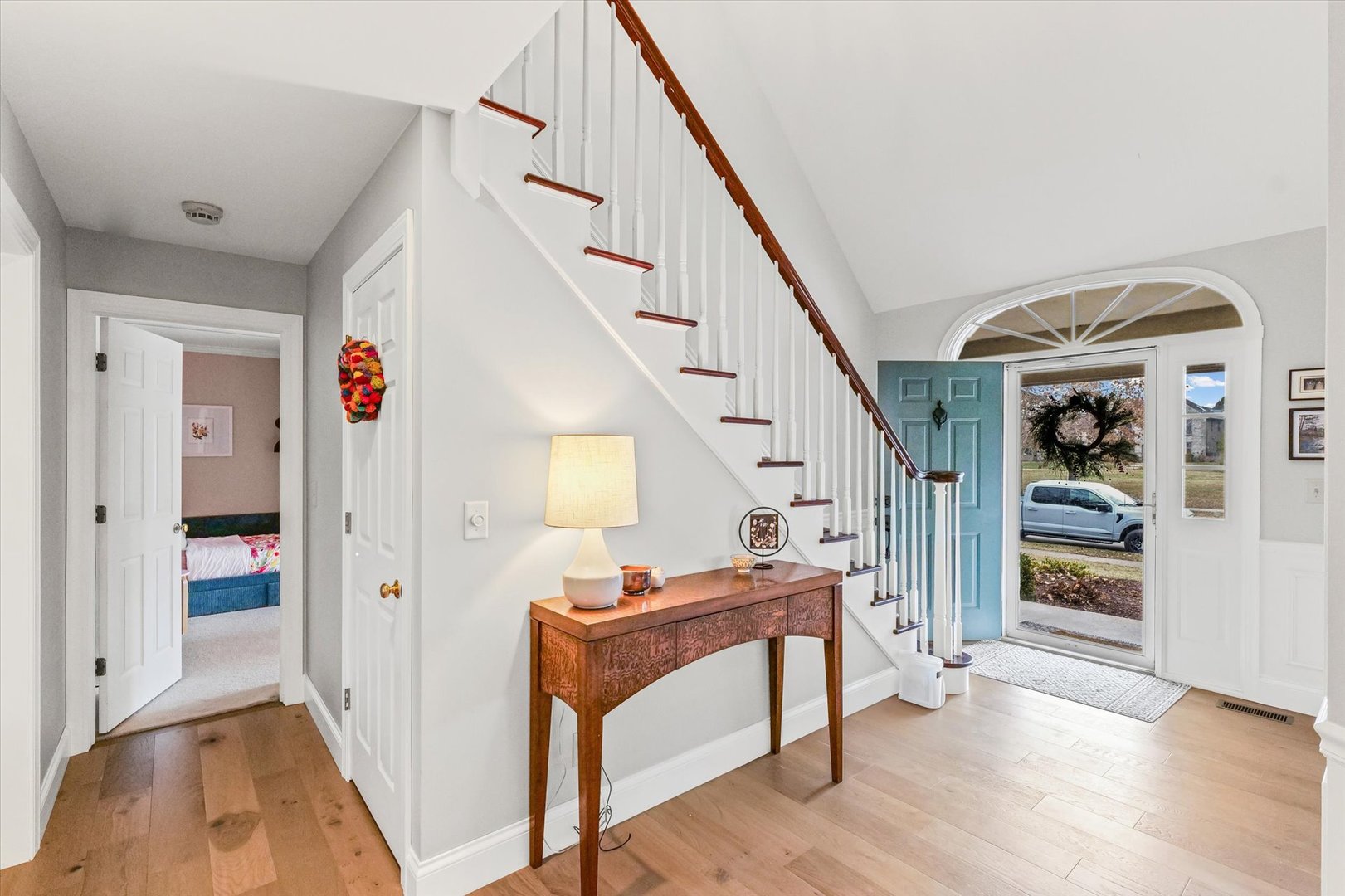 2504 Branch Road Champaign, IL 61822 - Photo 4 of 52 a view of front door with hallway and wooden floor