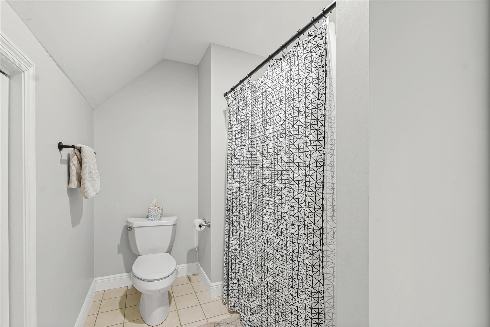 2504 Branch Road Champaign, IL 61822 - Photo 41 of 52 a white toilet sitting next to a shower curtain