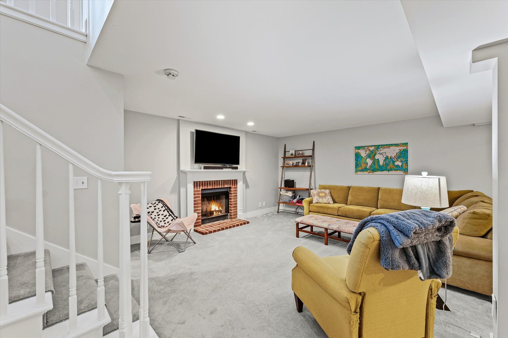 2504 Branch Road Champaign, IL 61822 - Photo 44 of 52 a living room with furniture a fireplace and a flat screen tv