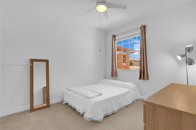 a bathroom with a shower curtain and a toilet