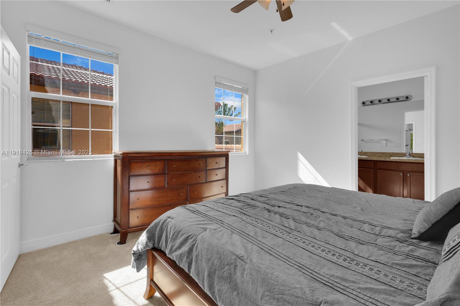 1516 Southwest 147th Avenue Pembroke Pines, FL 33027 - Photo 18 of 29 a bedroom with a bed and a window