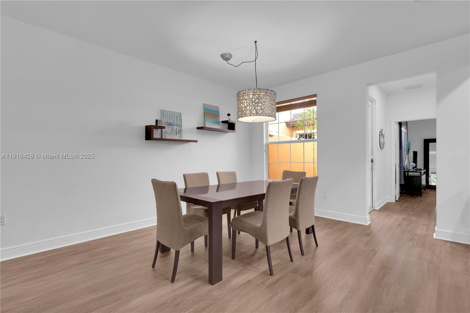 1516 Southwest 147th Avenue Pembroke Pines, FL 33027 - Photo 4 of 29 a view of a dining room with furniture window and wooden floor