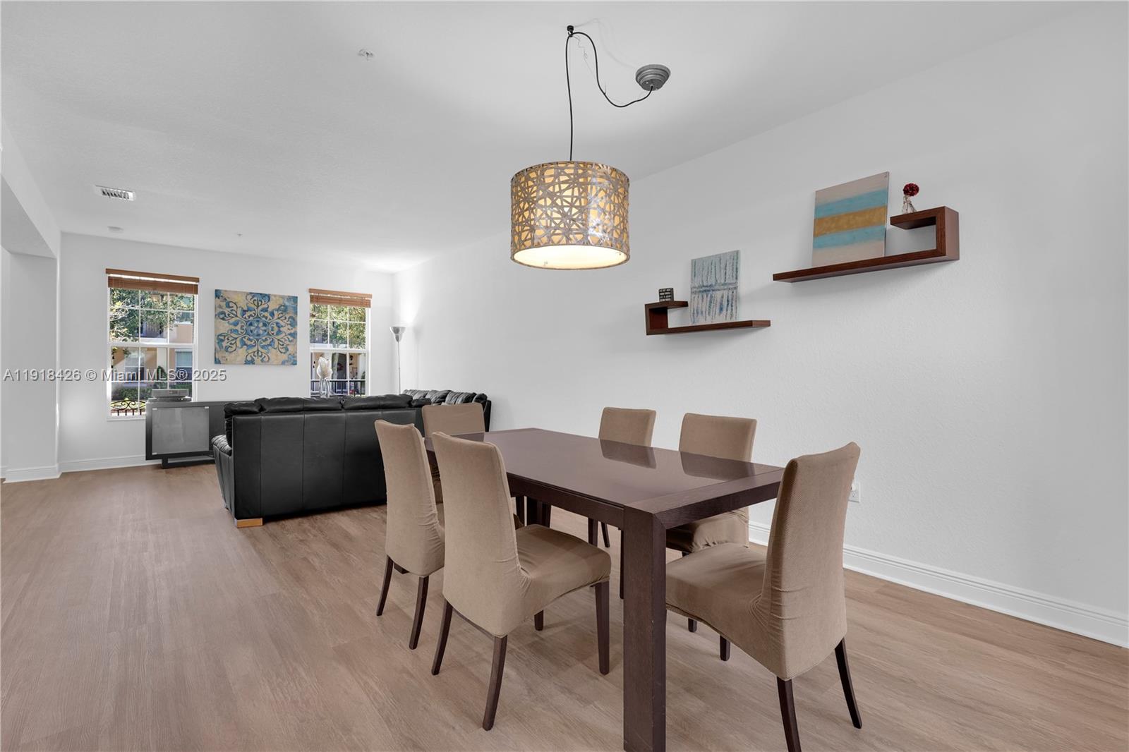 1516 Southwest 147th Avenue Pembroke Pines, FL 33027 - Photo 5 of 29 a dining room with furniture and window